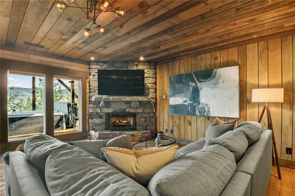 249 Settlement Road Epworth, GA 30541 - Photo 53 of 74 a living room with furniture a flat screen tv and a fireplace