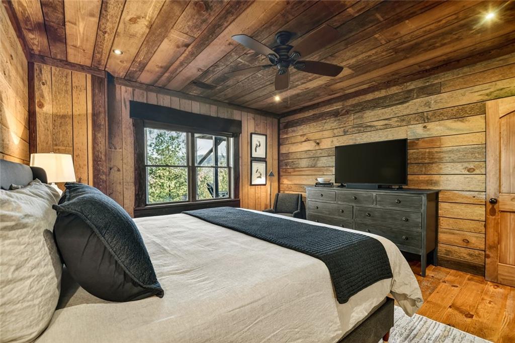 249 Settlement Road Epworth, GA 30541 - Photo 59 of 74 a bedroom with a bed and a flat screen tv