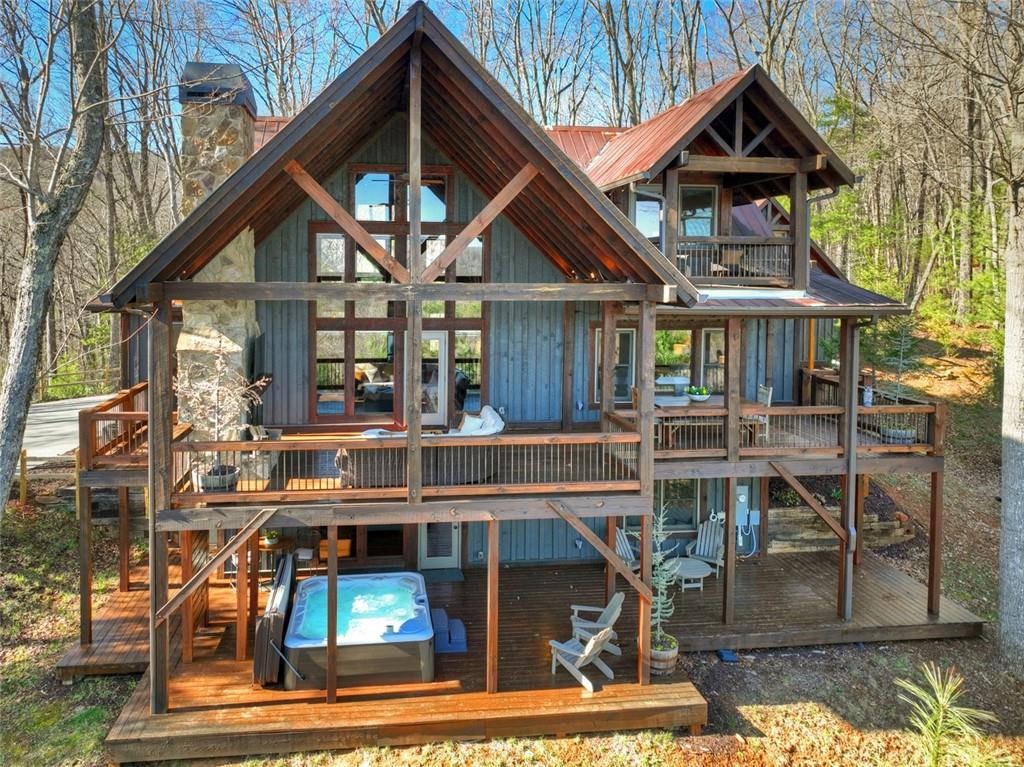 249 Settlement Road Epworth, GA 30541 - Photo 67 of 74 a view of house with large windows and a table