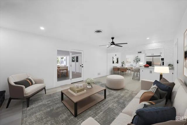 a living room with furniture and white walls