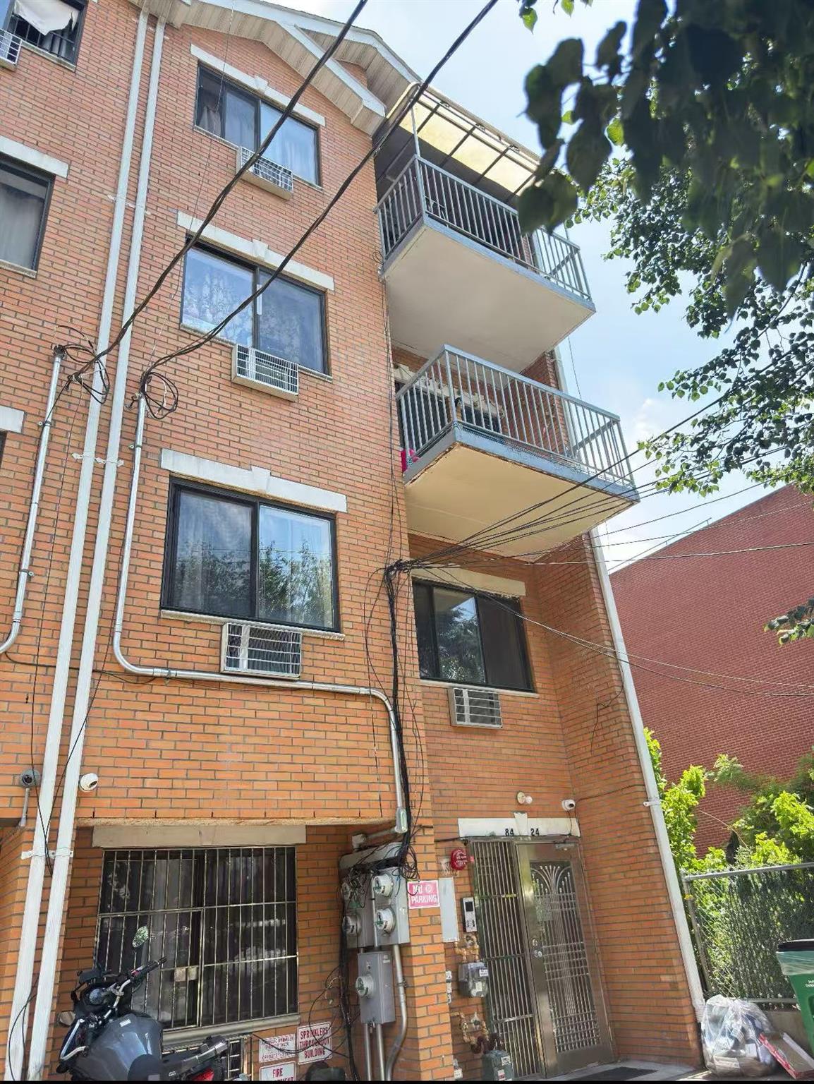 84-24 57th Road Queens, NY 11373 - Photo 2 of 5 View of building exterior