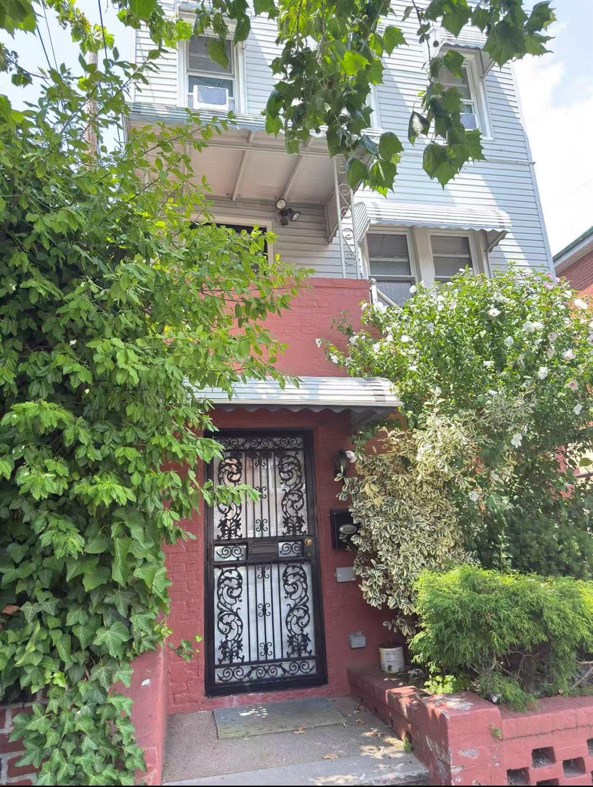 84-24 57th Road Queens, NY 11373 - Photo 4 of 5 View of exterior entry