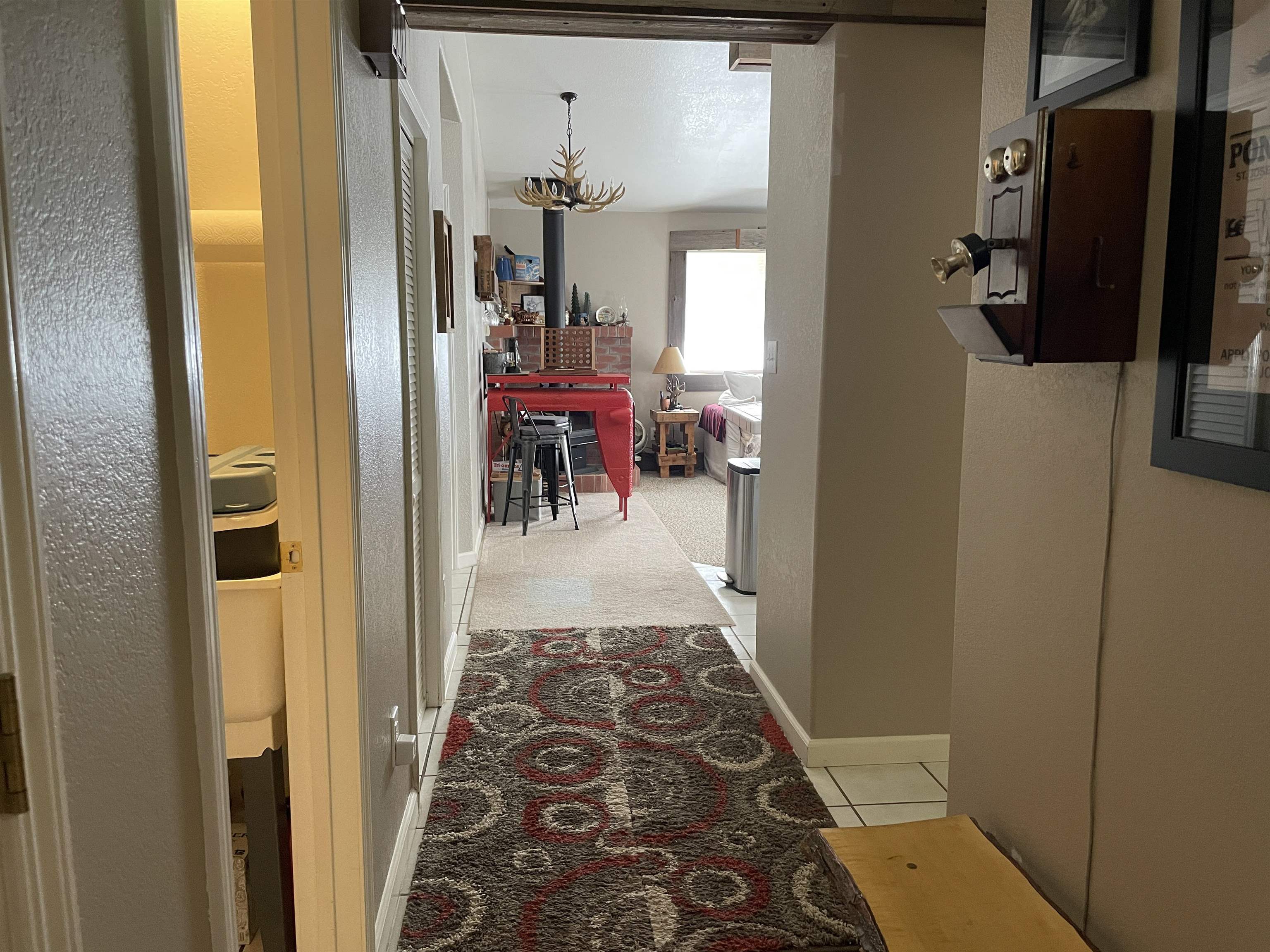 1154 Rocky Cliff Road Portola, CA 96122 - Photo 12 of 15 a view of a hallway to a livingroom with furniture