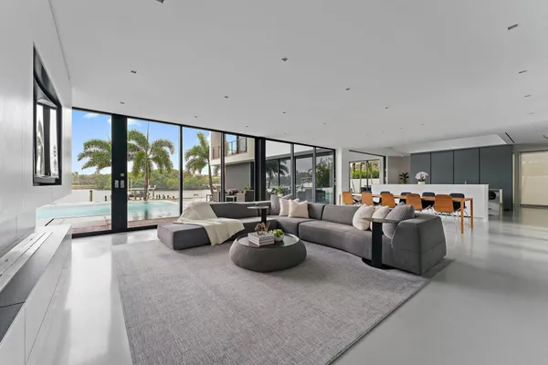 a living room with kitchen and furniture
