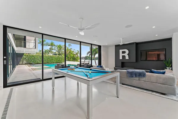 a spacious bedroom with a bed and a table in it