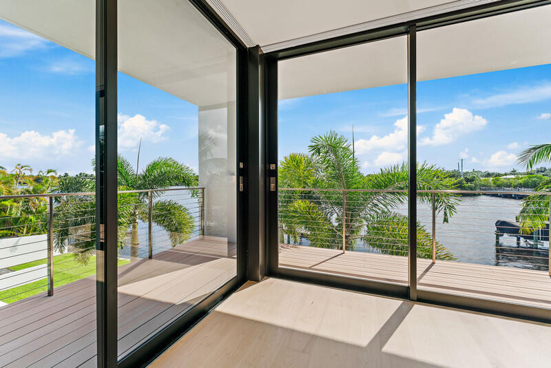 5706 Holly Lane Jupiter, FL 33458 - Photo 17 of 34 a view of a glass door with a balcony