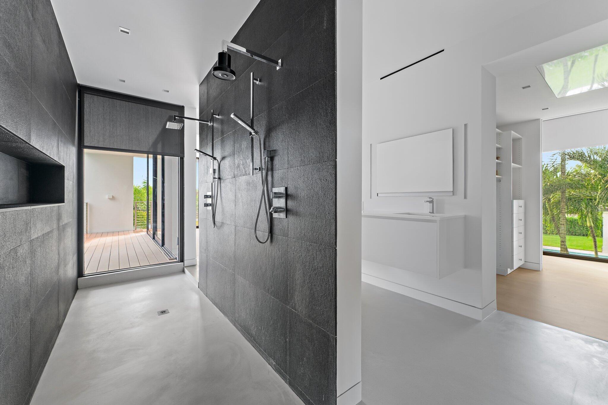 5706 Holly Lane Jupiter, FL 33458 - Photo 18 of 34 a bathroom with a shower and a tub