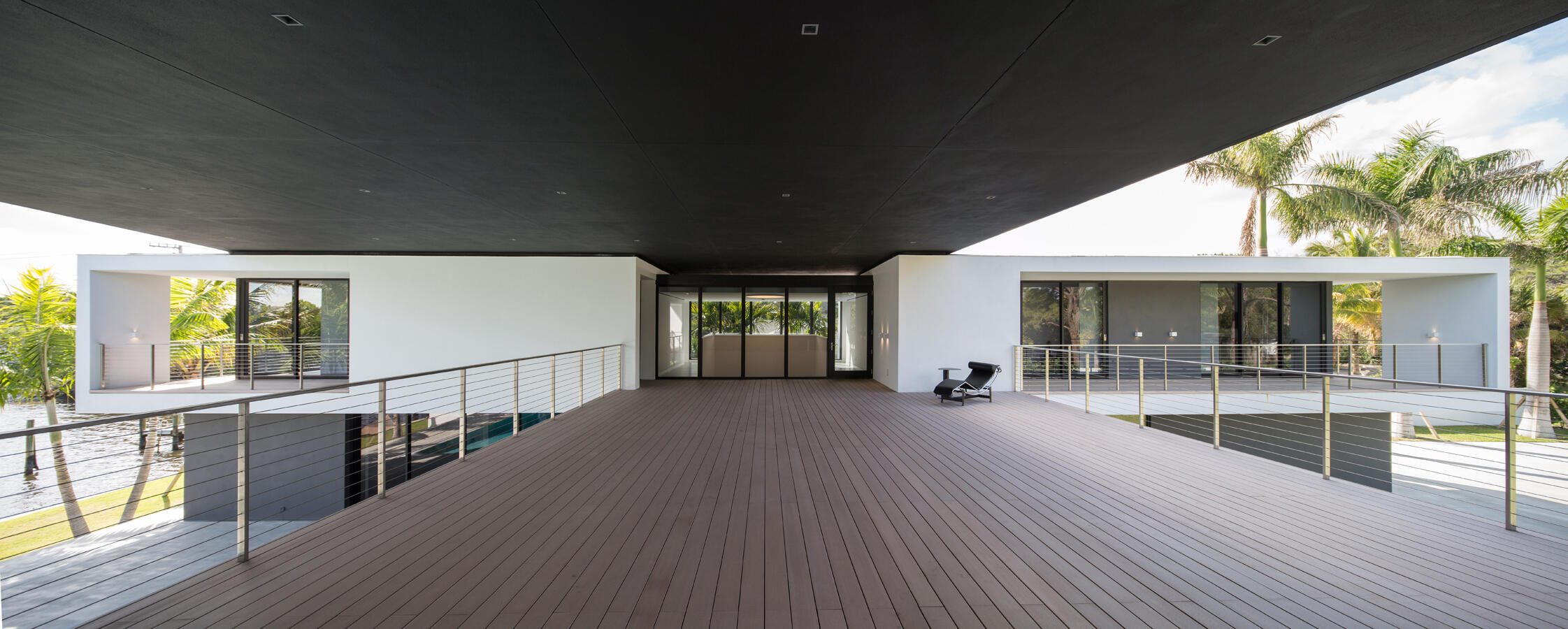 5706 Holly Lane Jupiter, FL 33458 - Photo 27 of 34 a view of a house with wooden floor and roof