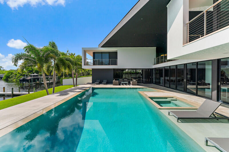 5706 Holly Lane Jupiter, FL 33458 - Photo 30 of 34 a view of a house with swimming pool and sitting area