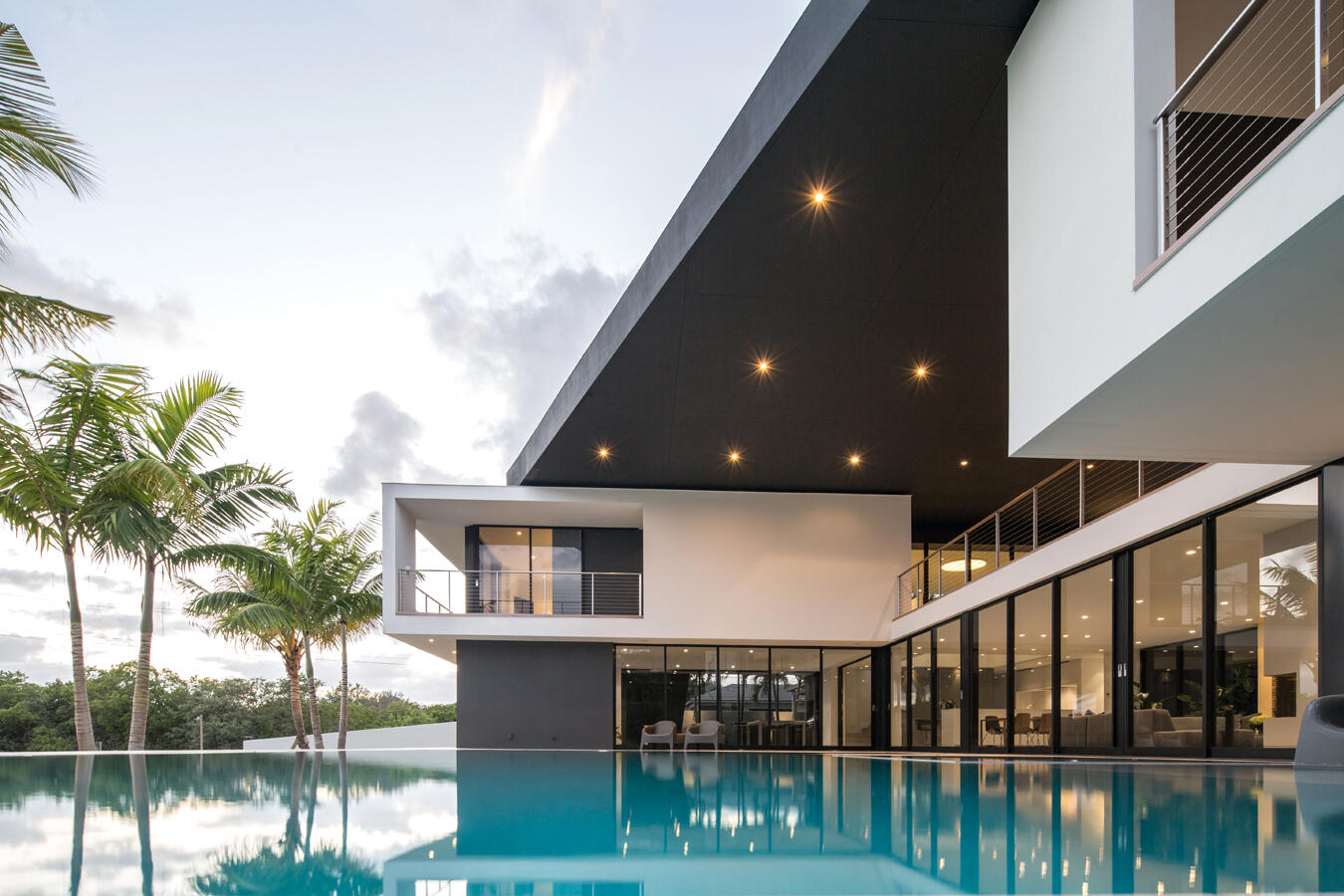 5706 Holly Lane Jupiter, FL 33458 - Photo 3 of 34 a view of house with swimming pool and glass windows