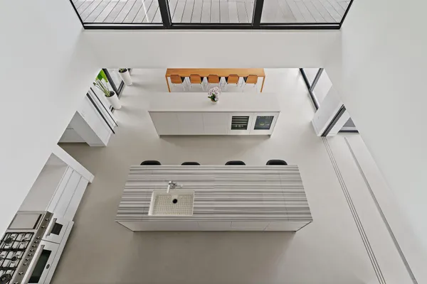a stove top oven sitting inside of a kitchen