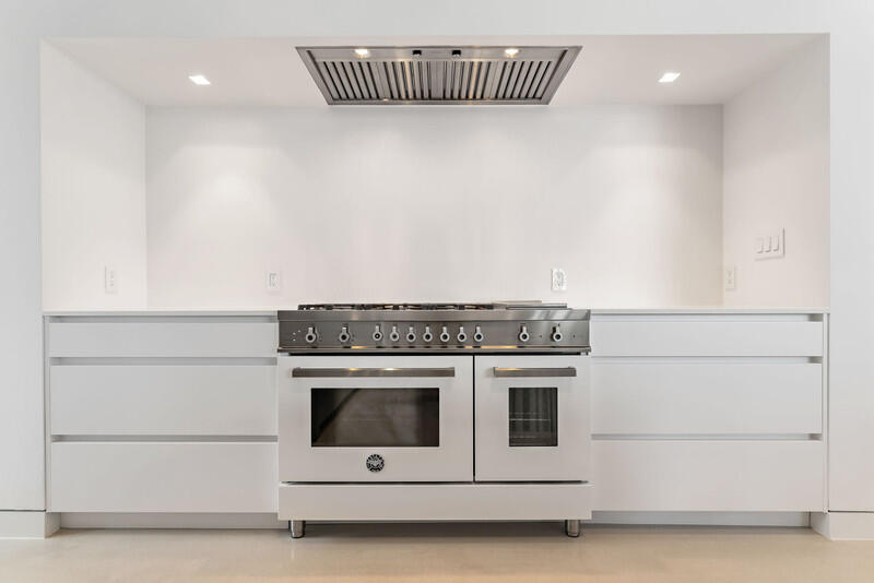 5706 Holly Lane Jupiter, FL 33458 - Photo 10 of 34 a stove top oven sitting inside of a kitchen
