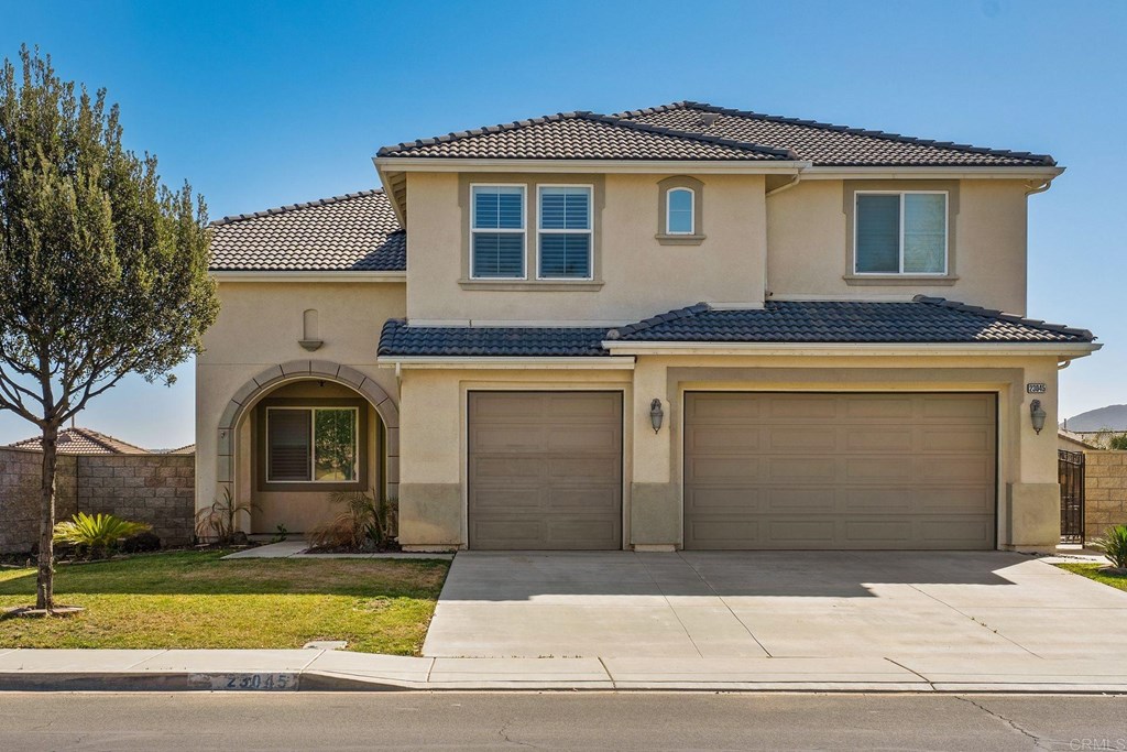 23045 Catt Road Wildomar, CA 92595 - Photo 1 of 1 a front view of a house with garden