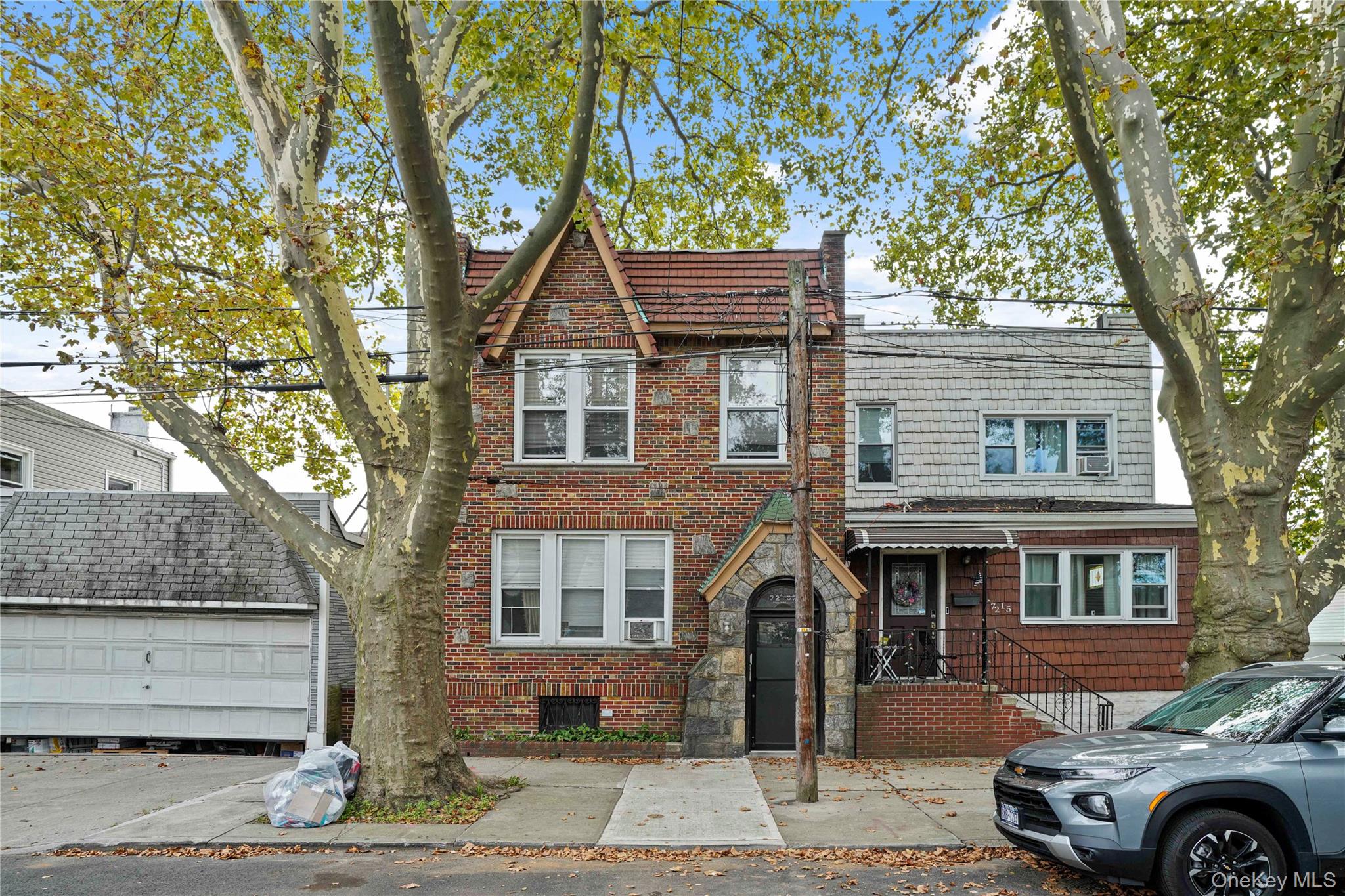 View of front of property with stone siding and brick siding