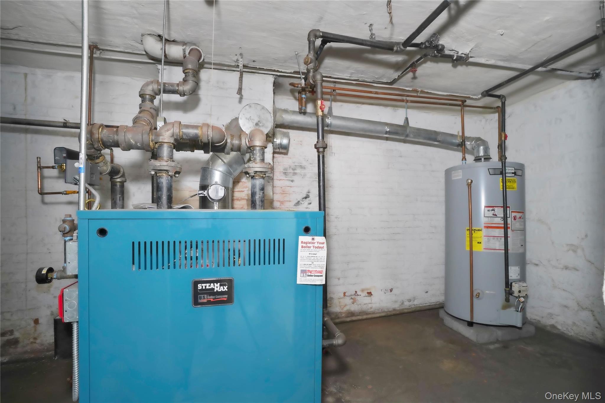 72-07 73rd Street Queens, NY 11385 - Photo 33 of 44 Utility room with water heater and a heating unit