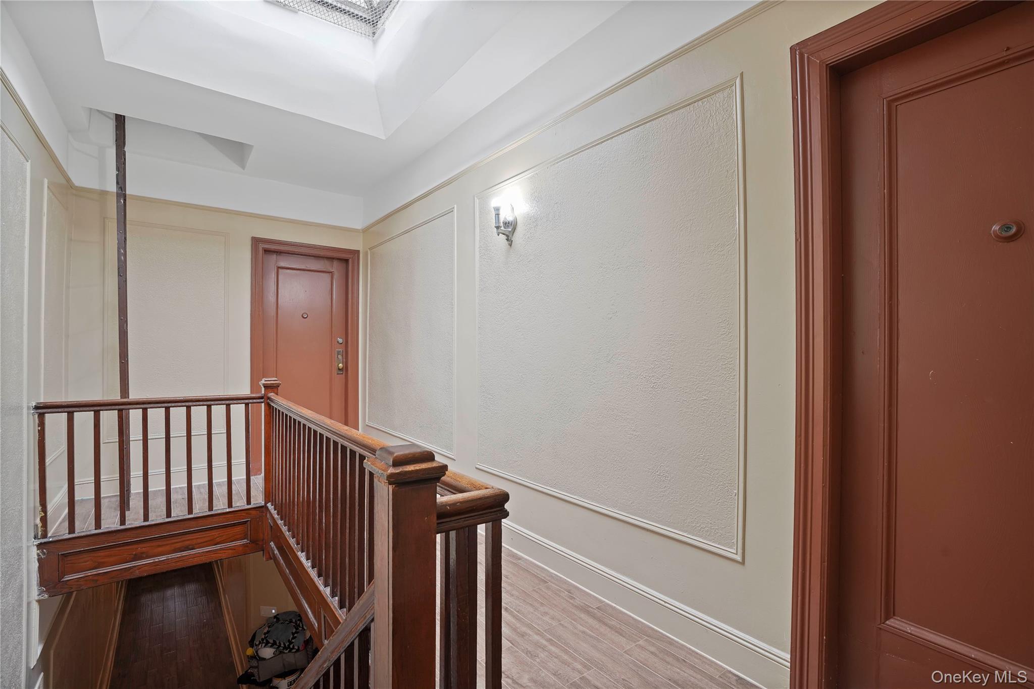 72-07 73rd Street Queens, NY 11385 - Photo 5 of 44 Hallway with an upstairs landing and light wood-style floors