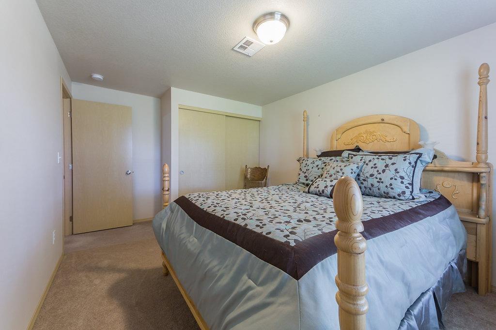 12622 Perry Road White City, OR 97503 - Photo 16 of 29 a bedroom with a bed and a dresser
