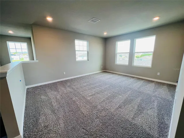 en empty room with windows