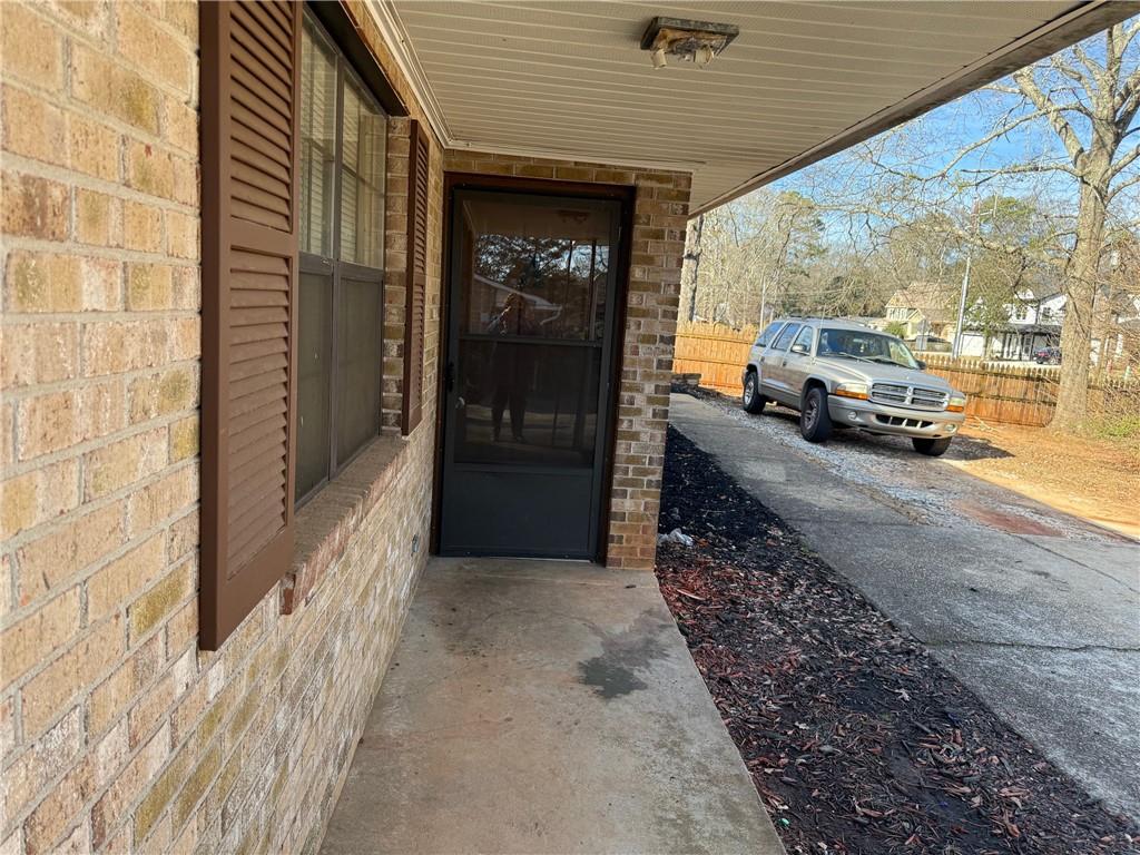 1085 Eastview Road Northeast Conyers, GA 30012 - Photo 11 of 14 a view of a pathway both side of building