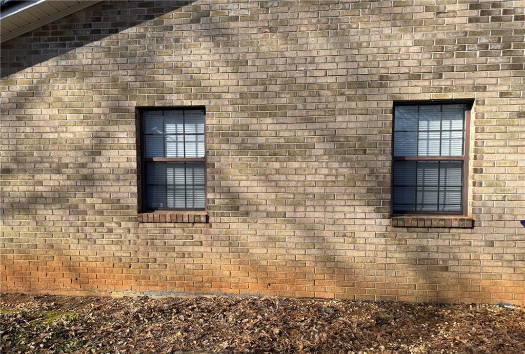 1085 Eastview Road Northeast Conyers, GA 30012 - Photo 13 of 14 a brick building with a door