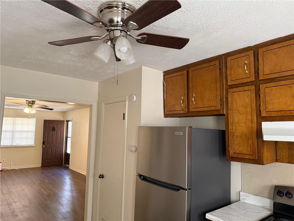 1085 Eastview Road Northeast Conyers, GA 30012 - Photo 6 of 14 a view of a refrigerator and a window in a room
