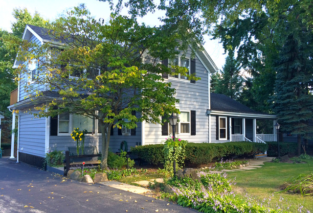 a front view of a house with garden