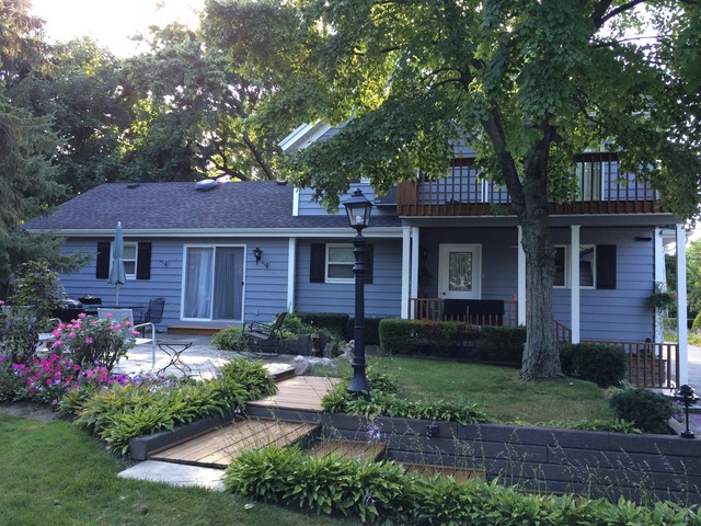 1241 Telegraph Road Lake Forest, IL 60045 - Photo 2 of 10 a front view of a house with garden