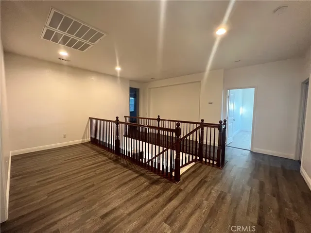 a room with a bed and cabinets