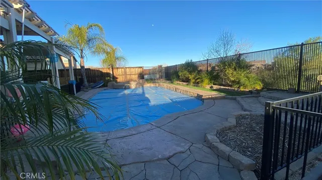 a view of a backyard with palm trees
