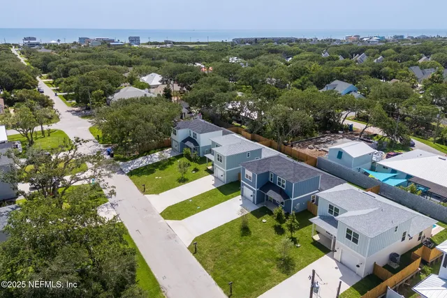 an aerial view of a house with a garden