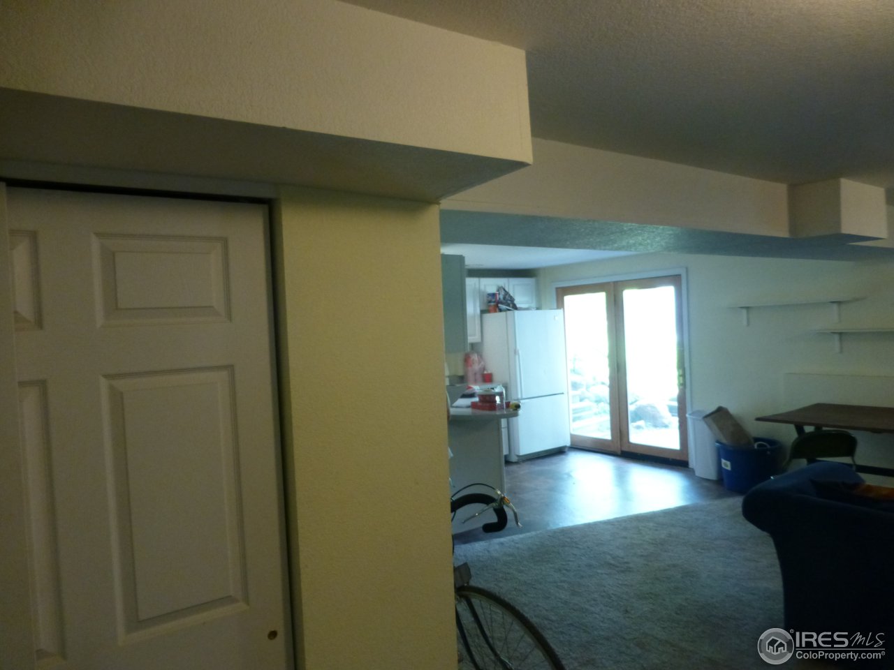 1835 Baseline Road Boulder, CO 80302 - Photo 11 of 39 lwr lvl view from liv rm to kitchen & entrnce
