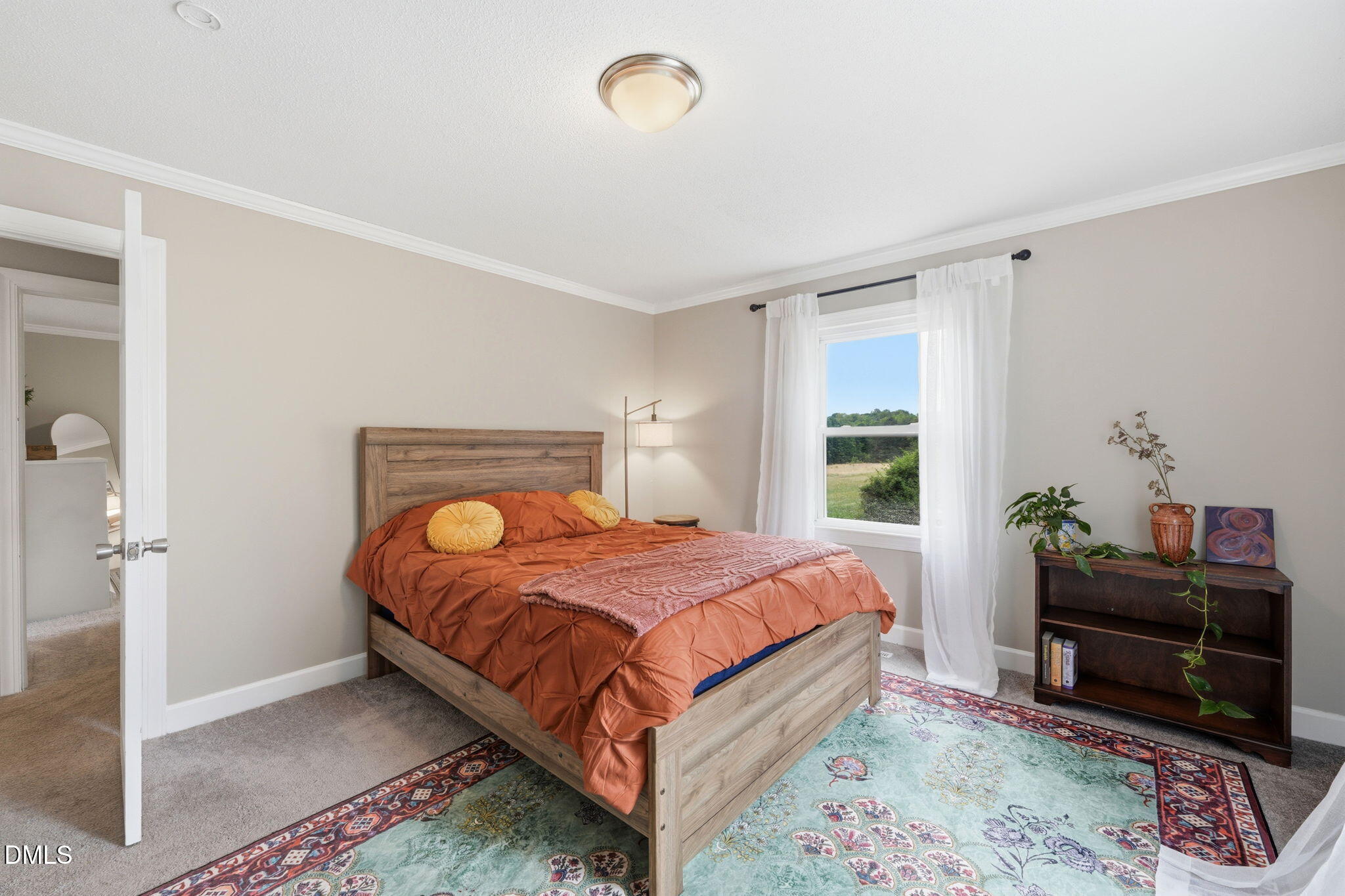 3200 Mill Creek Road Efland, NC 27243 - Photo 32 of 44 a bedroom with a bed and a window
