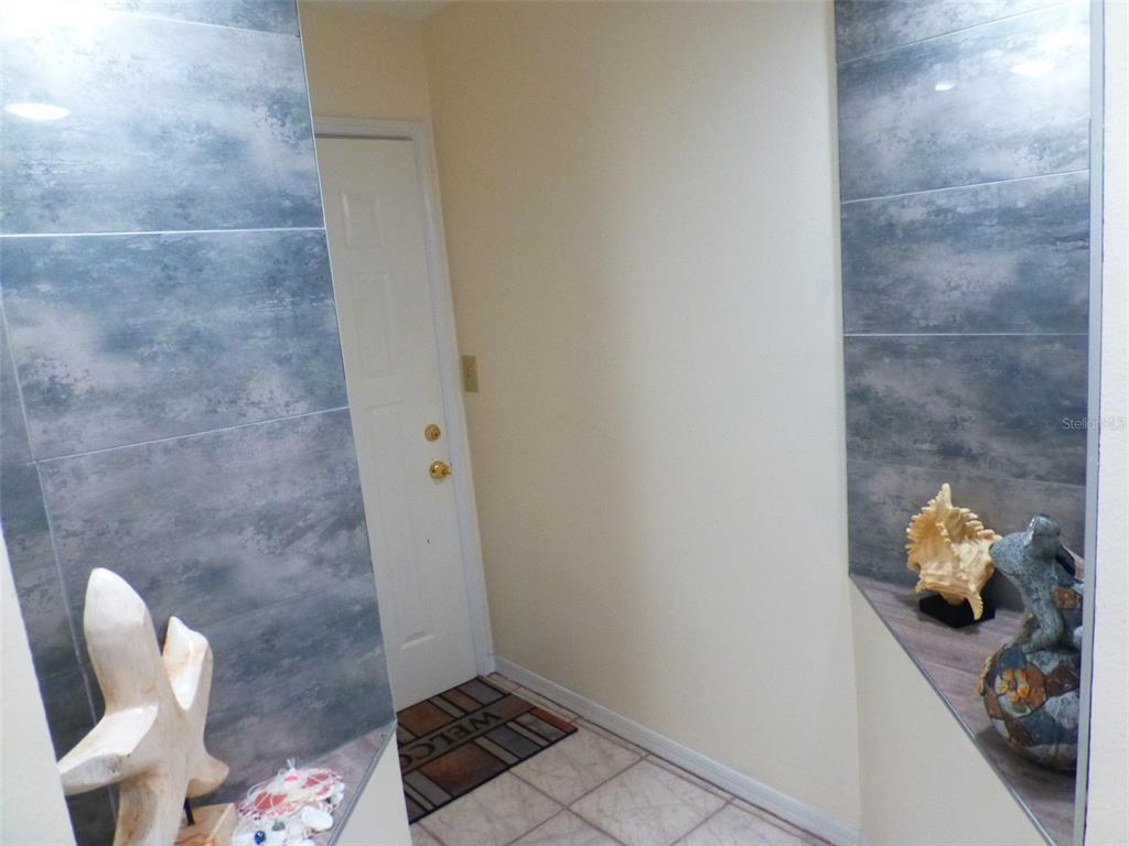 5557 Sea Forest Drive, Unit 215 New Port Richey, FL 34652 - Photo 21 of 42 a bathroom with a toilet