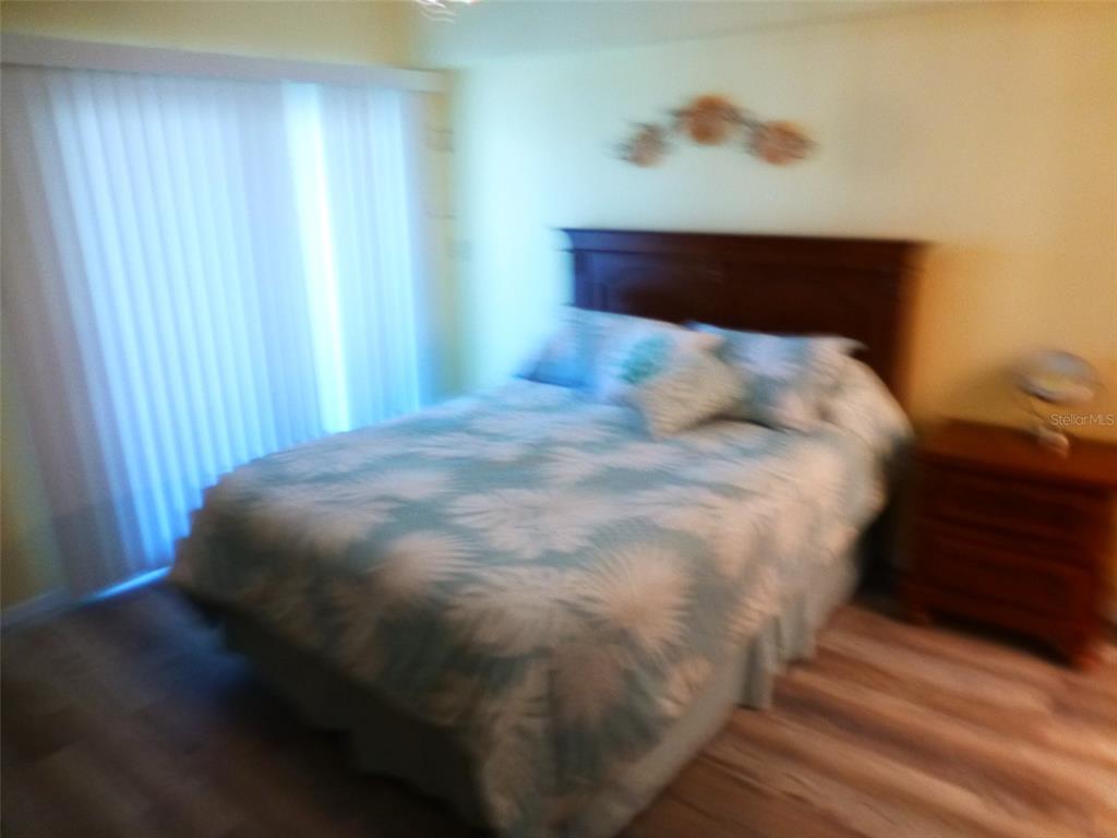 5557 Sea Forest Drive, Unit 215 New Port Richey, FL 34652 - Photo 26 of 42 a close up of a bed