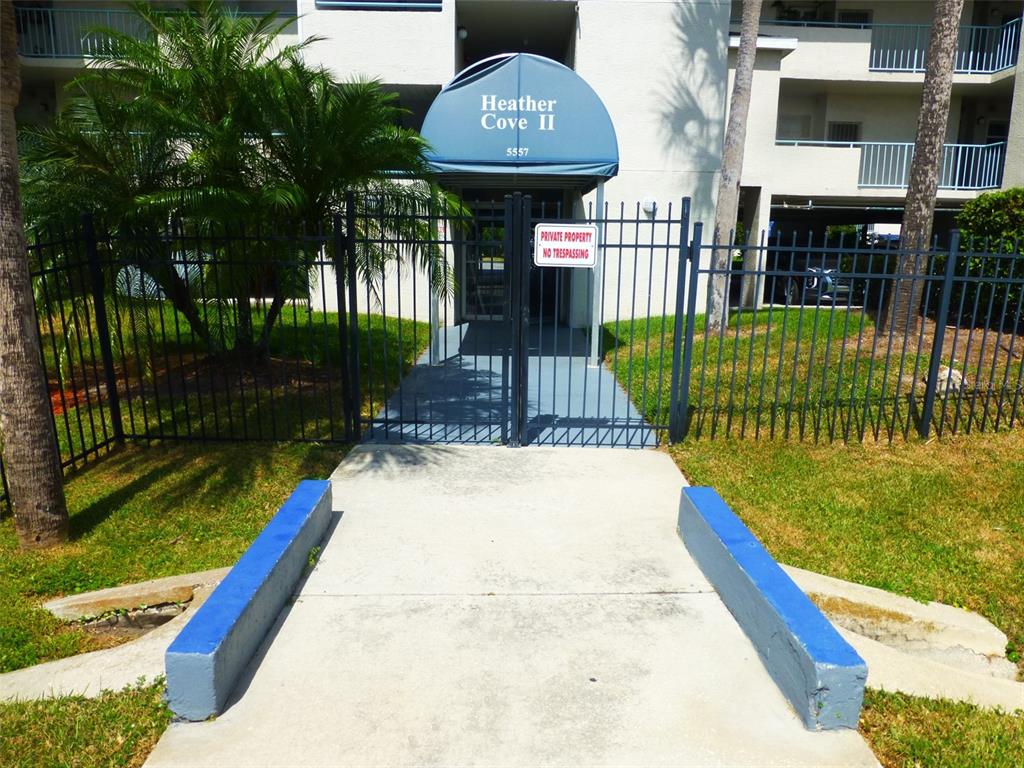5557 Sea Forest Drive, Unit 215 New Port Richey, FL 34652 - Photo 31 of 42 a view of a back yard of the house and a yard