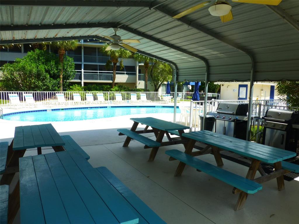 5557 Sea Forest Drive, Unit 215 New Port Richey, FL 34652 - Photo 32 of 42 a outdoor view with a sitting space
