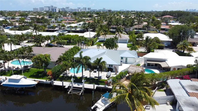 an aerial view of a house with a lake view