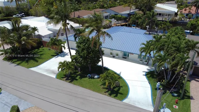 a view of a house with a yard and garden