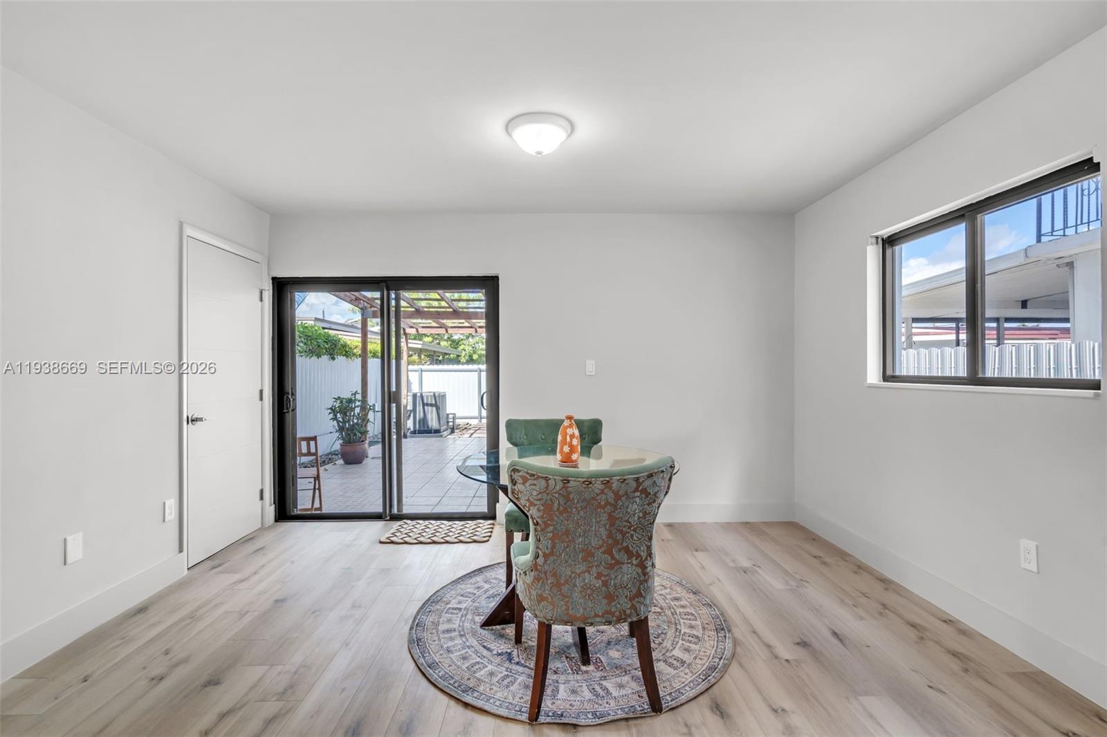 8773 Southwest 36th Street Miami, FL 33165 - Photo 12 of 47 a dining room with furniture and window
