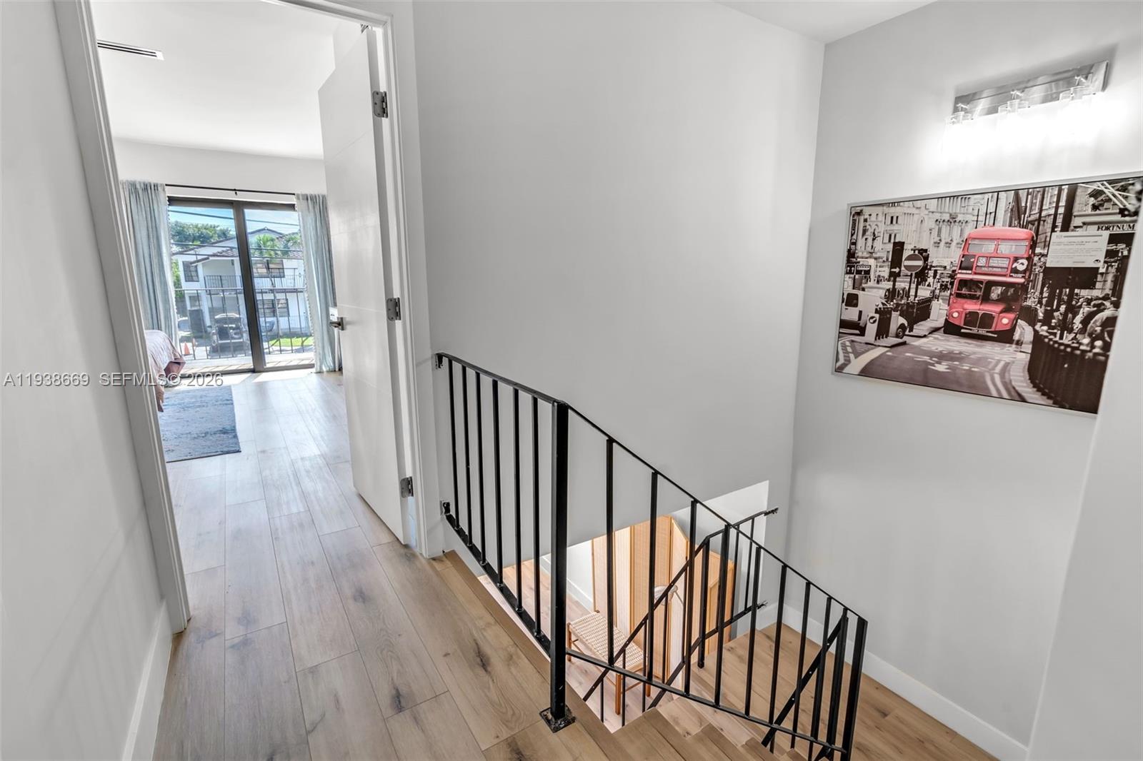 8773 Southwest 36th Street Miami, FL 33165 - Photo 14 of 47 a view of a hallway with wooden floor and entryway