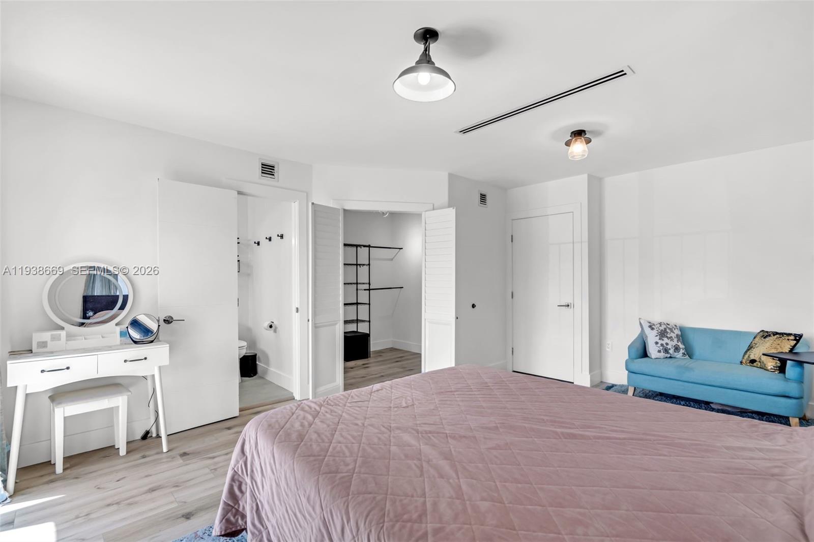 8773 Southwest 36th Street Miami, FL 33165 - Photo 16 of 47 a bedroom with a bed and a view of kitchen