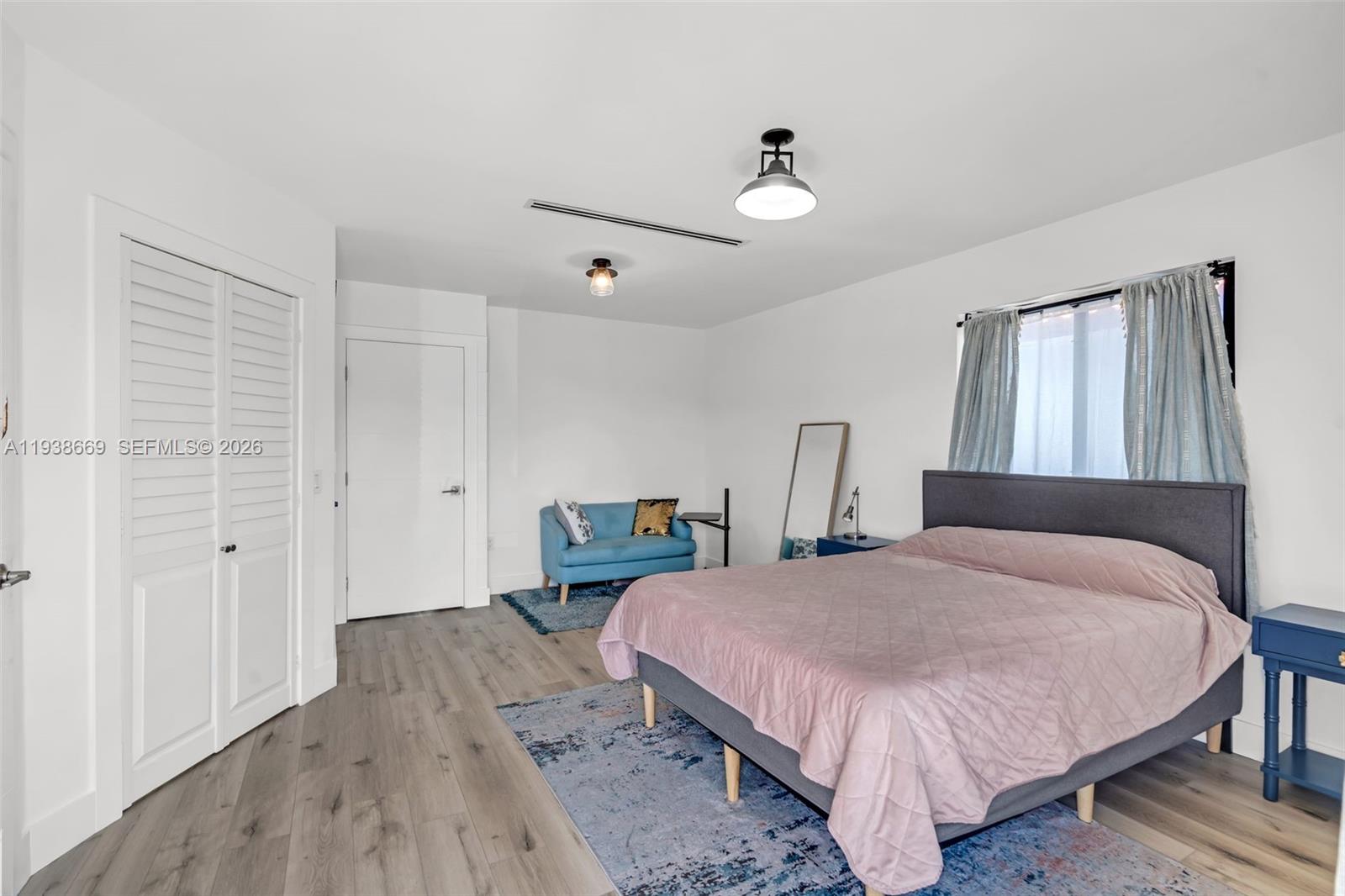 8773 Southwest 36th Street Miami, FL 33165 - Photo 17 of 47 a bedroom with a bed and a closet