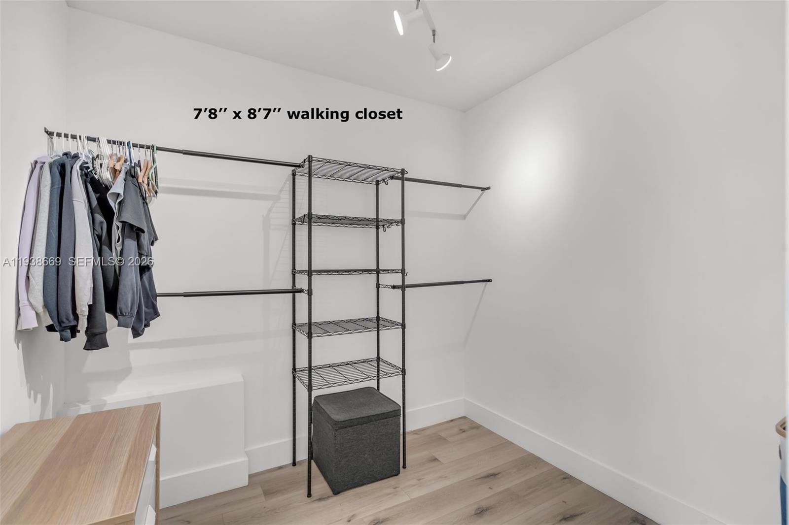 8773 Southwest 36th Street Miami, FL 33165 - Photo 19 of 47 a view of walk in closet with clothes and shoes