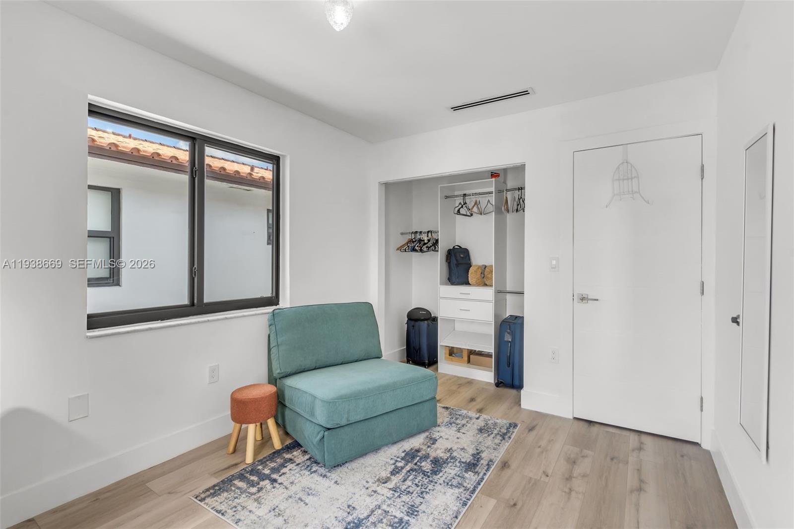 8773 Southwest 36th Street Miami, FL 33165 - Photo 25 of 47 a living room with furniture and a wooden floor