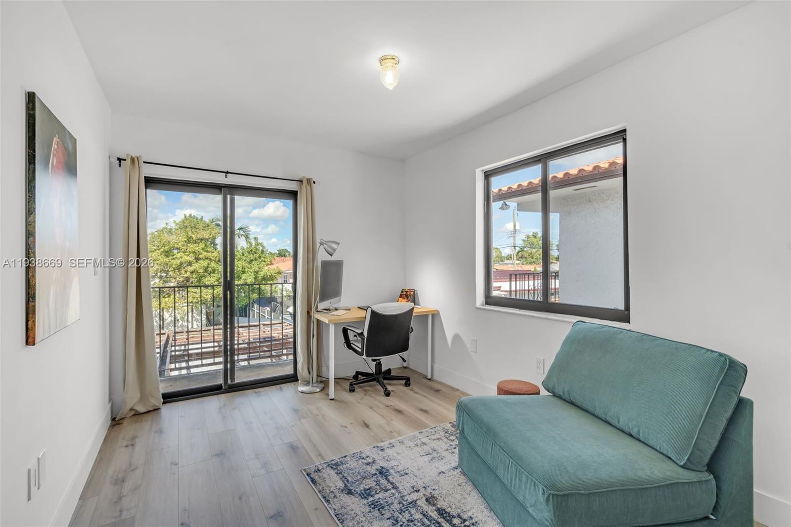 8773 Southwest 36th Street Miami, FL 33165 - Photo 27 of 47 a living room with furniture and a window