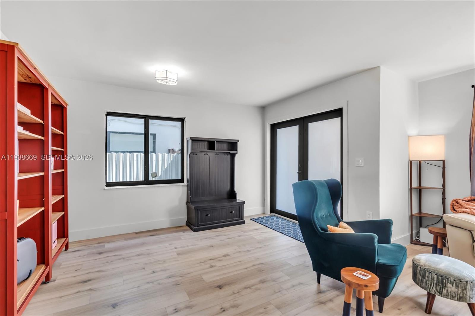 8773 Southwest 36th Street Miami, FL 33165 - Photo 5 of 47 a living room with furniture and a flat screen tv