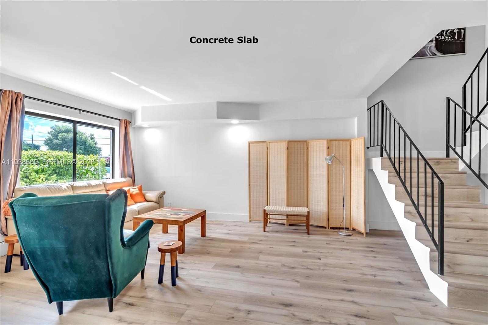 8773 Southwest 36th Street Miami, FL 33165 - Photo 8 of 47 a living room with furniture and a wooden floor