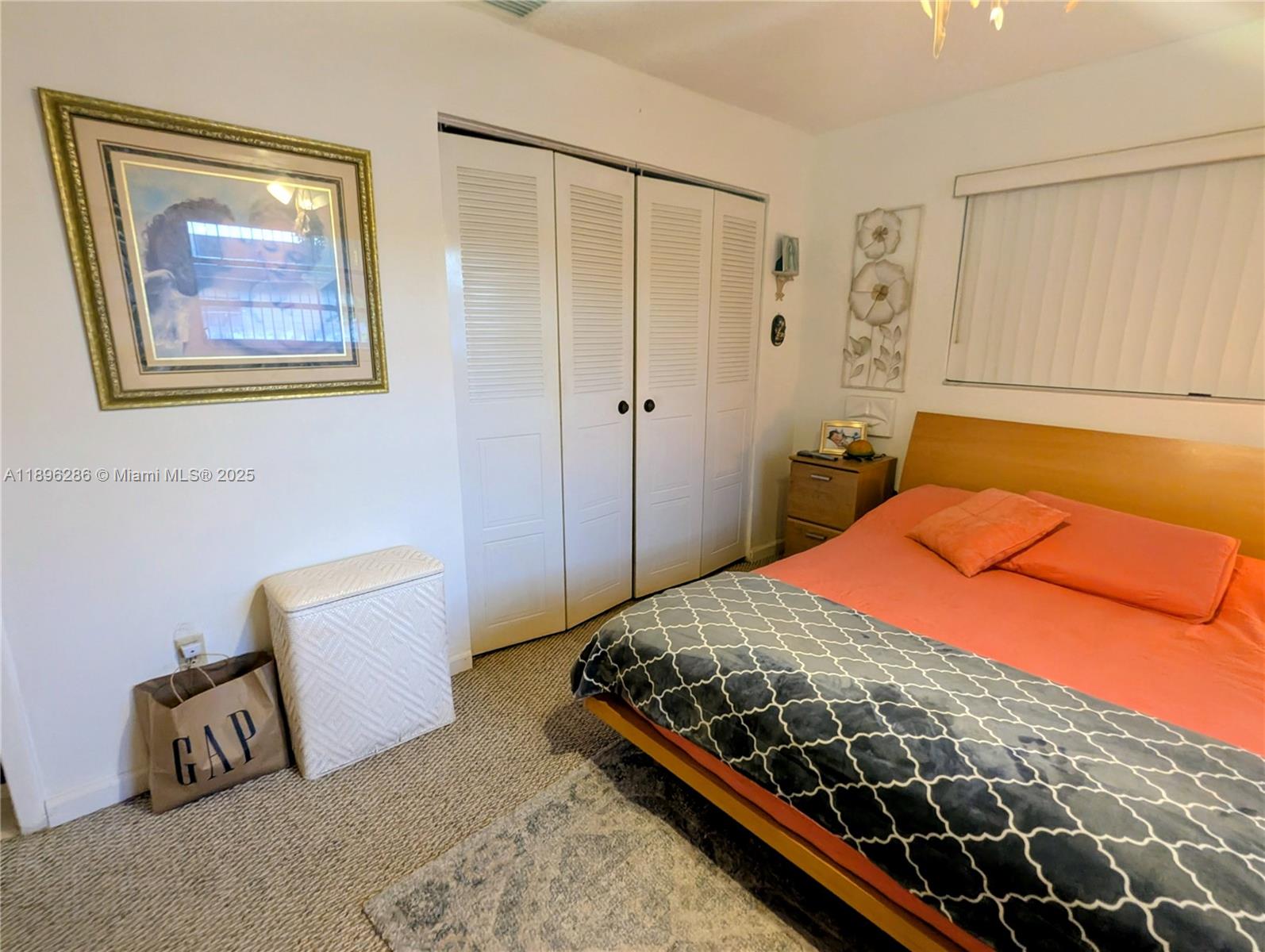 3031 Northwest 74th Avenue Hollywood, FL 33024 - Photo 24 of 34 a bedroom with a bed and a lamp on dresser