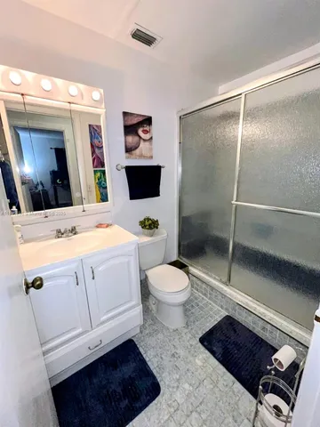 a bedroom with furniture and a chair