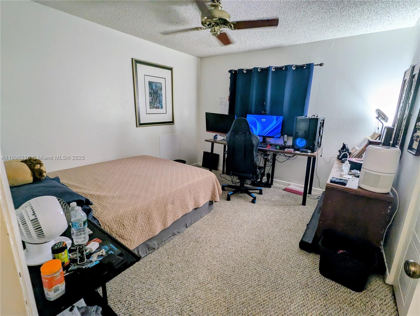 3031 Northwest 74th Avenue Hollywood, FL 33024 - Photo 26 of 34 a bedroom with furniture and a chair